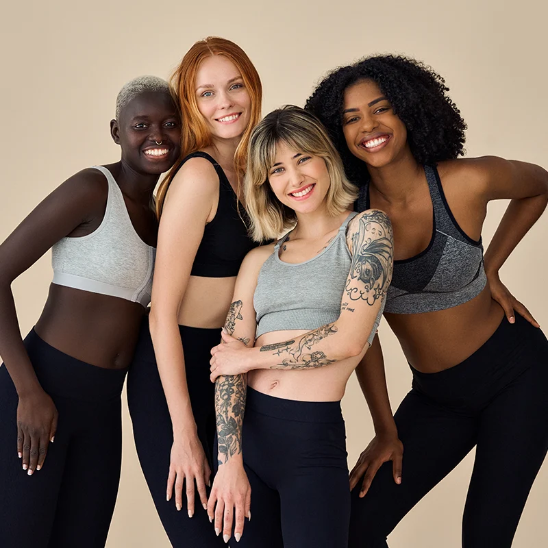 4 multicultural beauty models wearing yoga tops and leggings