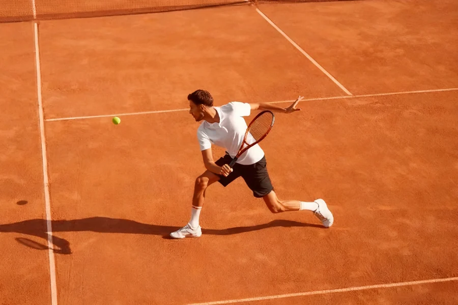 Man wearing comfortable tennis wear playing tennis