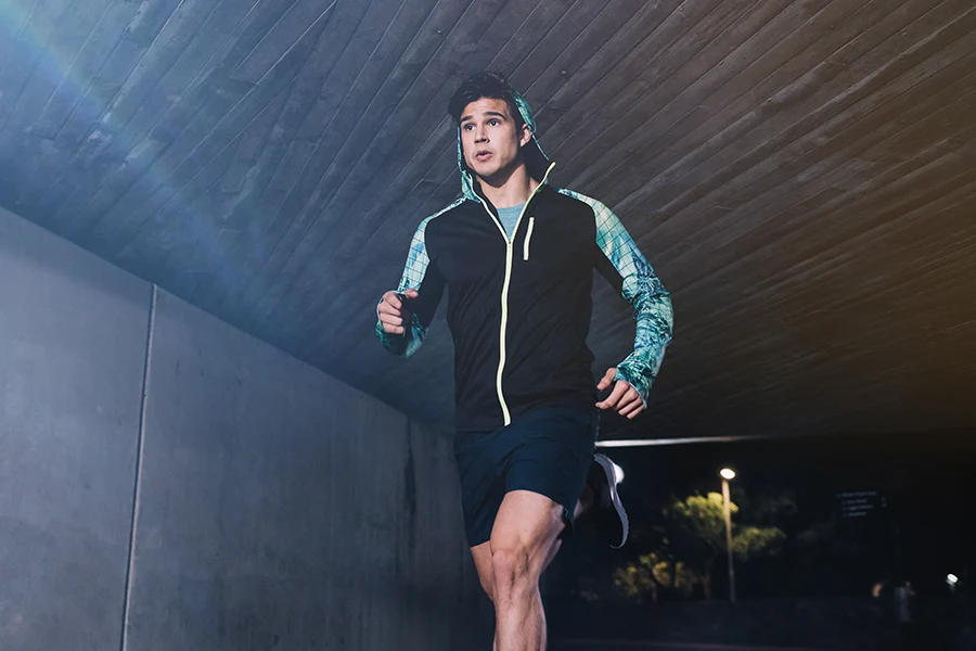 Young people wearing reflective clothing for running