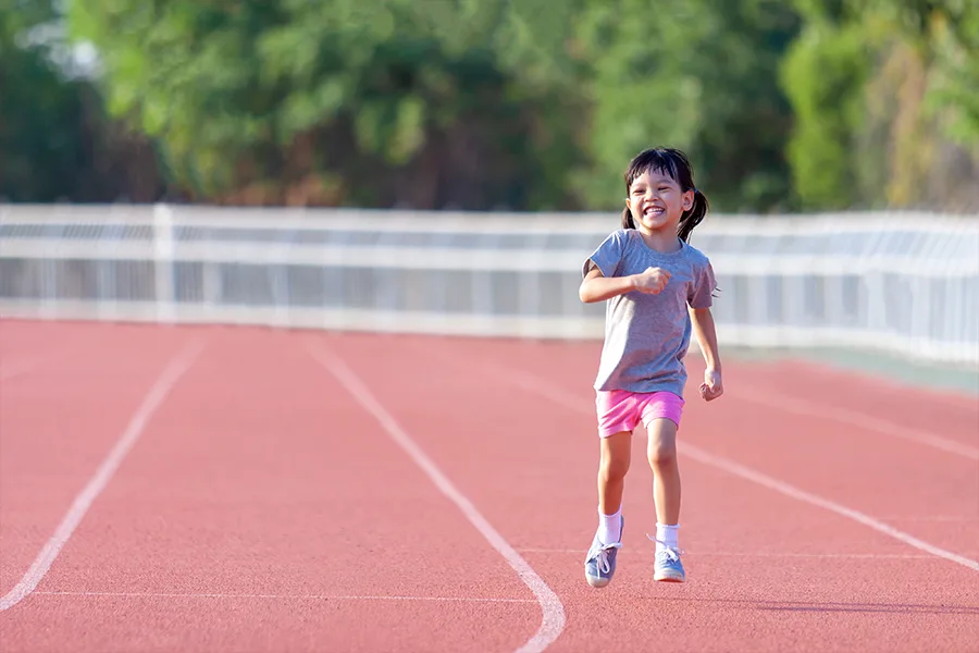 kid girl Smiling brightly wearing Activewear exercising